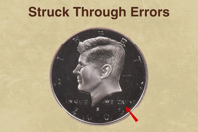 2005 Kennedy half dollar struck-through error showing debris impression on Kennedy's portrait with texture visible under magnification