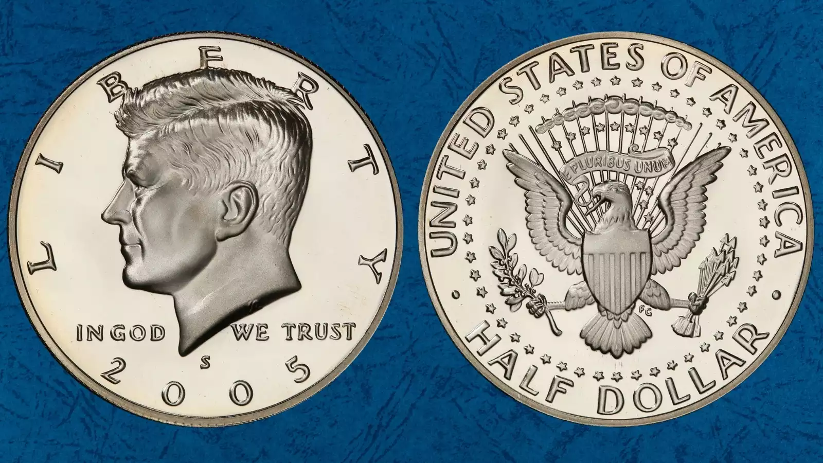 Group of 2005 Kennedy half dollar varieties showing P, D, S clad proof, and S silver proof coins